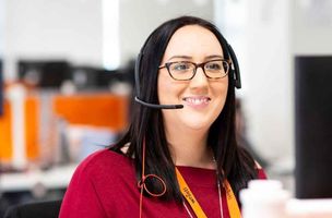 Contact centre employee smiling