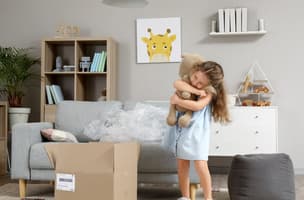 This is an image of a child holding a teddy to represent baby fulfilment