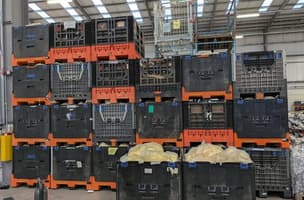 Bales of backing label paper ready for collection at a Whistl depot