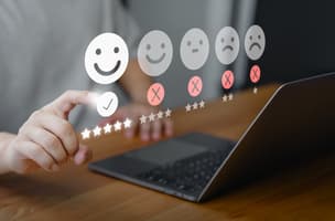 customer taps a smiley face to denote the delivery of great customer service