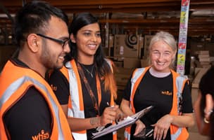 Whistl Fulfilment employees laughing during team briefing