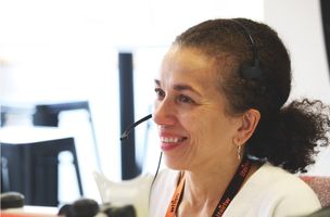 Smiling Female Customer Service Employee Wearing Headset