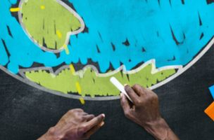 green and blue globe drawn on a chalkboard