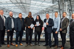 group of whistl employees showing their certification for apprenticeship 