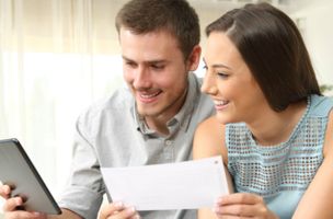 Whistl couple reading Direct Mail and going online banner