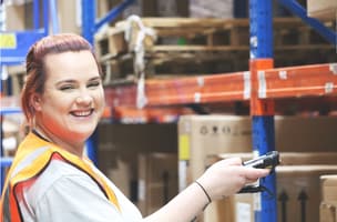 This is an image of Fulfilment Services for Subscription Companies - with a woman in the warehouse. 