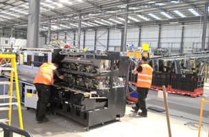 Whistl apprenticeship students examine machinery