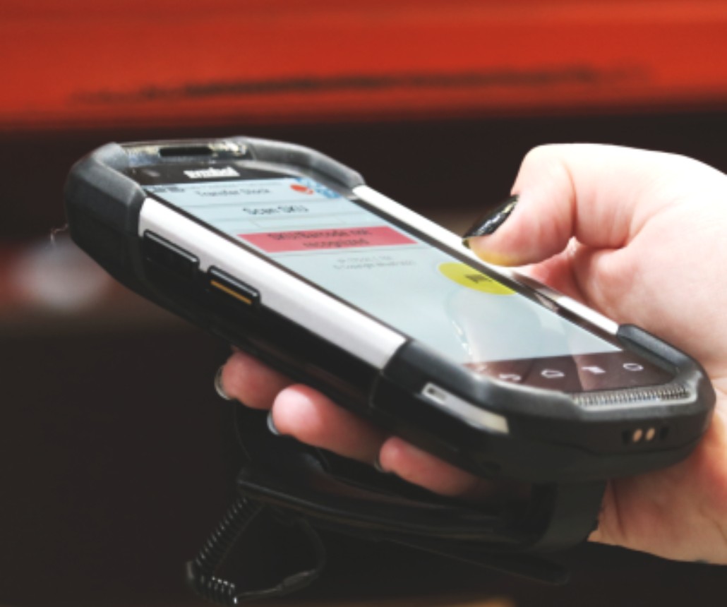 fulfilment orders being scanned with a handheld device in a warehouse