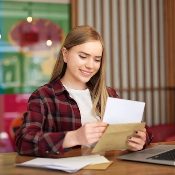 woman opening mail