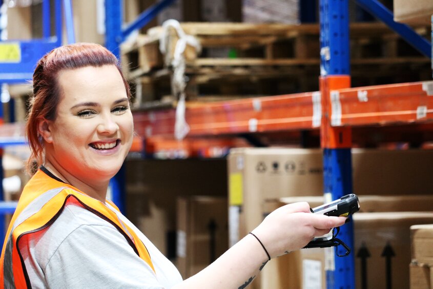 smiling-female-whistl-fulfilment-employee.jpg